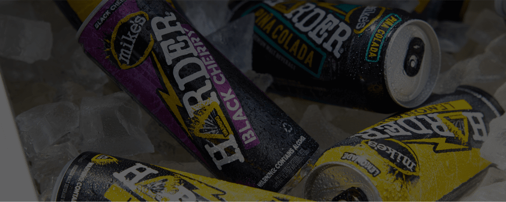 Mike's Harder backgroung with four cans: Lemonade, Piña Colada, Black Cherry & Lemonade