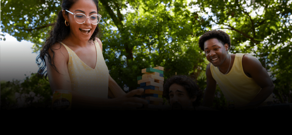 Group of people playing Jenga with Mike's Hard drinks